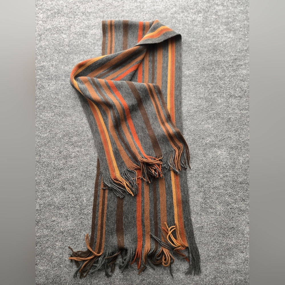 Womens‎ Scarf featuring multicolor stripes and fringe ends. Perfect Pop Of Color